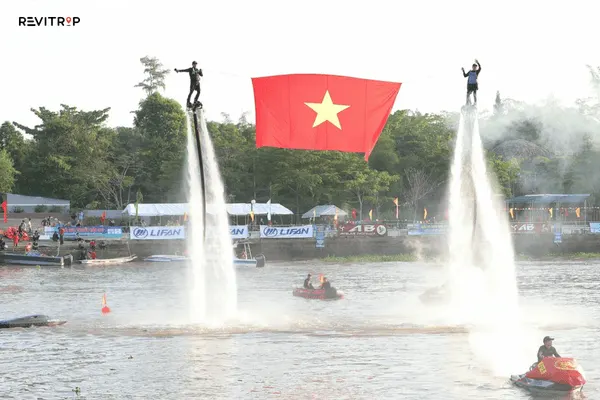 Water sports at Can Tho Beach including jet ski, kayak, and parasailing on the freshwater Hau River