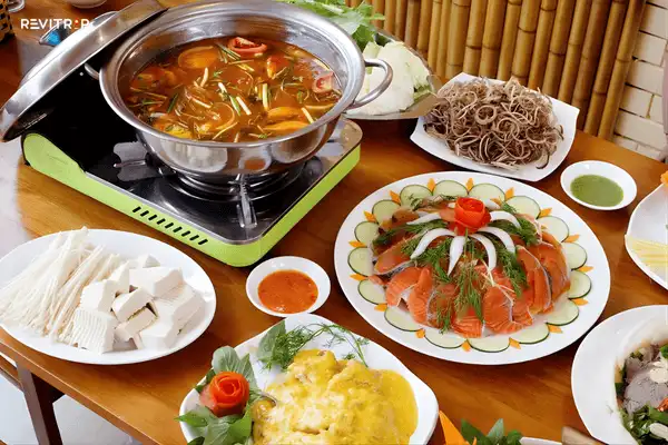 Salmon and sturgeon hotpot Sapa local food in a traditional hot and sour broth