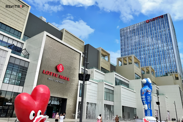 Exterior of Lotte Mall West Lake Hanoi with the Lotte Hotel tower in the background