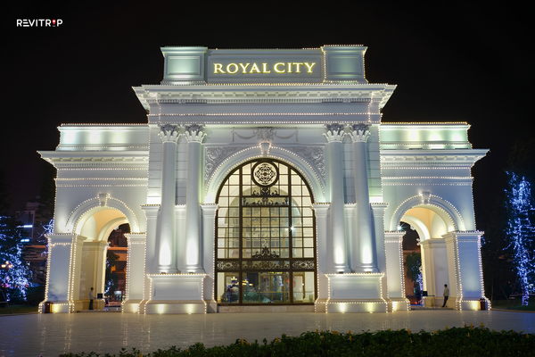 Illuminated entrance of Vincom Mega Mall Royal City at night in Hanoi