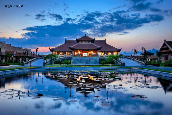 Traditional architecture and reflecting pond at Emeralda Resort Ninh Binh