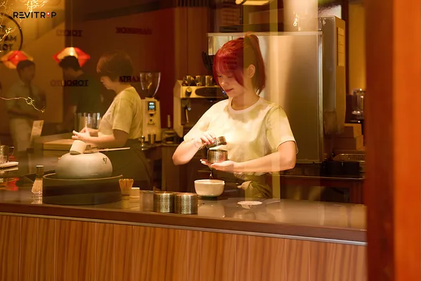 Staff preparing a Japanese matcha drink at The Matcha Tokyo Hoi An