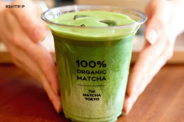 Matcha drink served in a branded cup at The Matcha Tokyo Hoi An