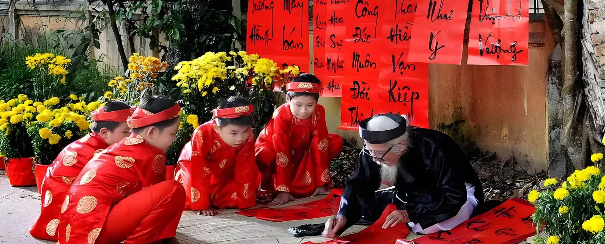 Traditional Vietnamese calligrapher writing red Lunar New Year scrolls as children watch during a cultural celebration